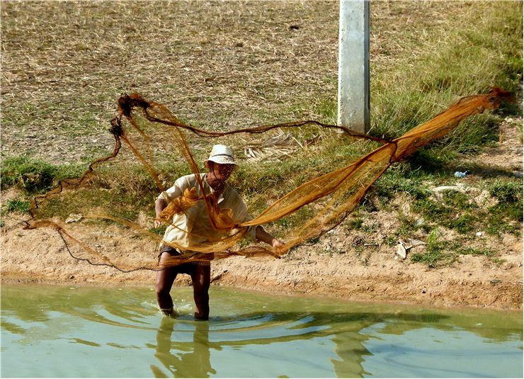 Picture Of Asian Fischer And Fishing Net